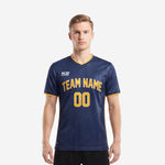 Custom royal blue soccer jersey in Navy Blue and Athletic Gold with arched team name and number on chest worn by adult male model front view