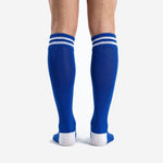 Royal blue soccer socks calf panel detail showing smooth sublimation surface and stripe cuff