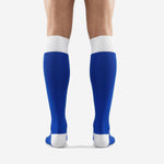 Close-up of white ribbed cuff band on custom royal blue soccer socks for club teams