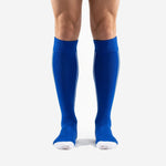 Custom blue soccer socks in Royal Blue with white toe cap shown from the front on adult male legs
