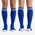 Pair of custom royal blue soccer socks showing double white stripe cuff and full polyester knit construction