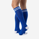 Custom royal blue soccer socks rear view with white reinforced toe cap and ribbed calf panel