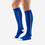 Custom blue soccer socks over-the-calf length with white stripe and white toe cap on both legs side view