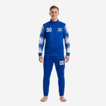 Custom royal blue soccer tracksuit front view showing full-zip jacket and tapered pants with white splash-fade sleeve print and team logo on chest