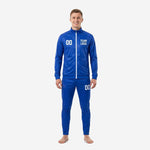 Custom royal blue soccer tracksuit front view showing white player number 00 on chest and team logo, full-dye sublimated 2-piece set