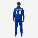 Full-zip stand-collar royal blue soccer tracksuit jacket detail with sublimated white stripe panel and ribbed cuffs