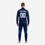 Navy and royal blue custom soccer tracksuit jacket detail showing stand collar, full zip, and diagonal royal blue chest panel