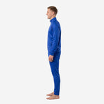 Custom royal blue soccer tracksuit side profile highlighting tapered leg cut and zipped ankle vent on matching pants