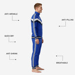 Close side detail of custom royal blue soccer tracksuit featuring sublimated white and navy stripe from shoulder to ankle cuff