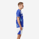 Custom Royal Blue soccer uniform left side view showing Sky Blue geometric panels on jersey and white shorts