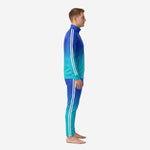 Custom royal blue and turquoise soccer tracksuit side view showing full-length white stripe on jacket sleeve and pant leg