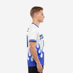 Side view of custom royal blue and white flame soccer jersey showing double-stripe sleeve cuffs and athletic cut