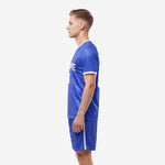 Men's custom Royal Blue soccer uniform set with V-neck collar and white side stripe shorts shown from side profile