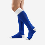 Custom royal blue and white soccer socks rear side view showing full calf panel and white toe detail
