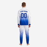 Pant leg detail of custom Royal Blue and White soccer tracksuit showing 3-stripe side panel and ribbed ankle cuff