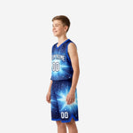 Opposite side view of custom royal blue youth basketball uniforms showing continuous starburst design across jersey and shorts