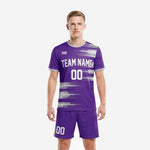 Chest detail of custom royal purple men's soccer team uniforms showing full-dye sublimation silver stripe pattern and crew neckline trim