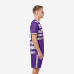 Shorts detail of custom royal purple men's soccer team uniforms showing silver side-stripe trim and sublimated leg number in white