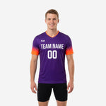 Front view of adult male wearing custom royal purple mens soccer training top with coral to orange sleeve gradient