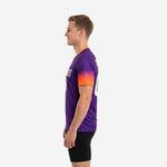 Close-up of orange V-neck collar trim on custom royal purple mens soccer training top