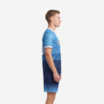Custom Sky Blue to Navy Blue sublimated blue soccer uniform side view showing gradient banding and white cuff trim