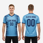 Detail of full-dye sublimation horizontal streak pattern on sky blue and navy blue mens custom training jersey