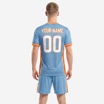 Close detail of honeycomb texture sublimated into sky blue custom soccer jersey with orange trim
