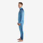 Custom sky blue soccer tracksuit left side view showing stand collar full-zip jacket and tapered pants with navy ankle gradient