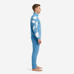 Sky blue soccer tracksuit side view showing white dot-burst splash pattern across full sleeve length and thigh panel