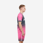Custom soccer kit in pink and charcoal with matching shorts, side view