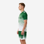 Custom soccer outfits for men Kelly Green gradient uniform right side view with white stripe on shorts leg