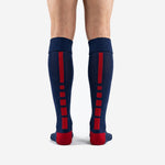 Navy blue custom soccer socks showing calf panel print zone and ribbed over-the-calf cuff detail