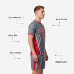 Custom soccer shorts in grey with red side panel and player number on thigh, part of full kit