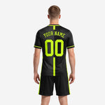 Close detail of black neon green custom soccer uniform with team name and number placement