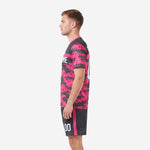 Second side view of custom soccer uniform in hot pink and charcoal digital camo pattern