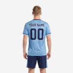 Custom soccer uniform kits for teams powder blue navy blue back view showing player name and number print zones on sublimated jersey