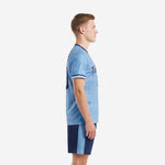 Custom soccer uniform kits for teams powder blue navy blue side view showing crew neck collar, sleeve cuff stripe, and shorts side panel