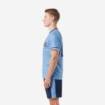 Custom soccer uniform kits for teams powder blue navy blue opposite side view displaying full-dye sublimation grid pattern across jersey and navy shorts