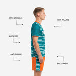 Orange custom soccer shorts with teal wave side panel, part of custom soccer uniform kits set