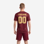 Custom soccer uniform men maroon jersey close-up showing Athletic Gold V-neck collar trim and sublimated team name lettering