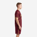 Soccer uniform men maroon and gold full kit left side view showing Athletic Gold side stripe on shorts and sleeve trim