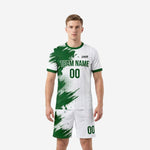 Custom soccer uniforms for teams package in Forest Green and White brush-stroke splash design, front view on adult male model