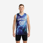 Custom sublimated basketball jerseys in navy with a full-body cyan lightning storm graphic, carolina blue V-neck trim, and white arced team name and front number