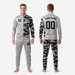 Custom sublimated soccer tracksuit pants detail showing Silver and Camo split with club branding strip on right leg