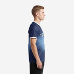 Sublimation soccer jersey design in Navy Blue and Sky Blue halftone dot pattern, left side view showing athletic cut and white sleeve cuff trim