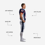 Close detail of sublimated navy football jersey showing red V-neck collar trim, white side panel edge, and bold white number with red outline on chest
