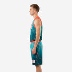 Close side-panel detail of teal basketball uniform with coral-red lightning sublimation and armhole binding