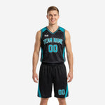 Custom teal basketball uniforms in black with curved teal side panels, arced team name, and front number on male model, front view