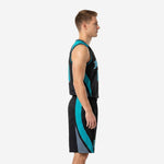 Side view of custom teal basketball uniform showing curved teal and grey panel running continuously from jersey ribs down the shorts leg