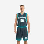 Custom teal basketball uniforms in charcoal showing front and back of the full jersey and shorts set with team name and numbers